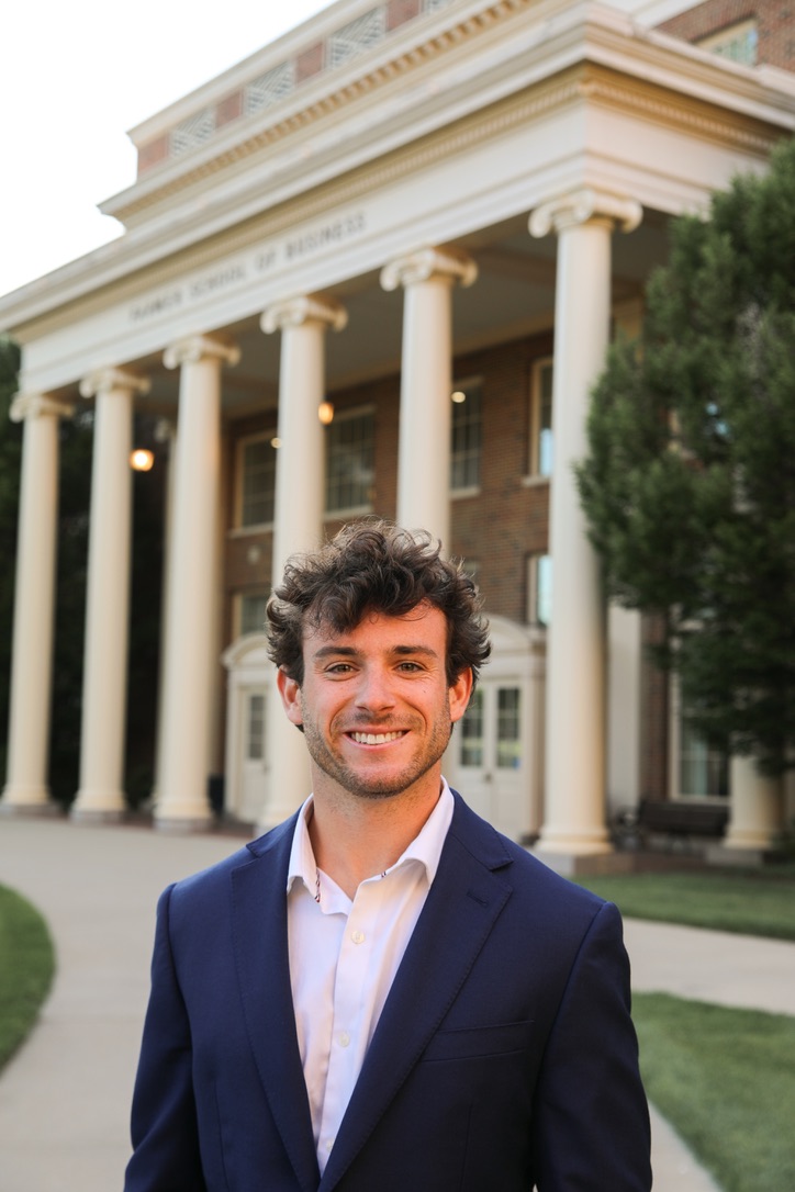 Alex Canupp, founder of Reesis, standing in front of Miami University's Farmer School of Business